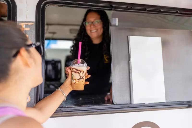 girl gets served at ice cream van
