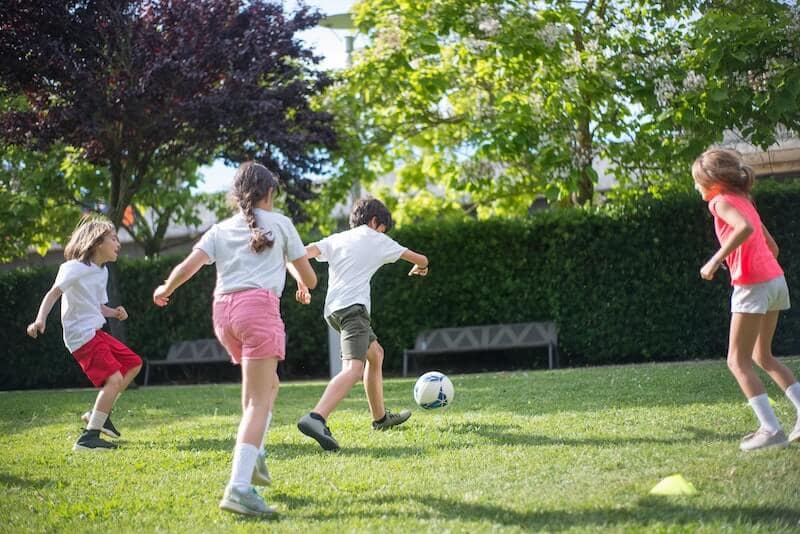 Kids playing football at a Bitrthday party